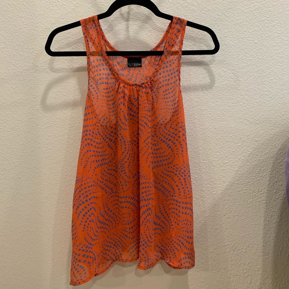 Red and blue pattered blouse